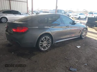 2015 BMW 4 Series 428i with VIN WBA4A5C54FG051307, listed as a IAAI auction lot 41774596 with 126,852 mi miles and . Bid and sale history available at carsss.com. Image 4.