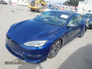 2021 Tesla Model S Long Range with VIN 5YJSA1E51MF442874, listed as a IAAI auction lot 39406495 with 36,127 mi miles and . Bid and sale history available at DreamBid. Image 2.