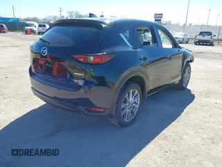 2020 Mazda CX-5 Grand Touring with VIN JM3KFBDMXL0763316, listed as a IAAI auction lot 41661958 with 64,881 mi miles and . Bid and sale history available at carsss.com. Image 4.