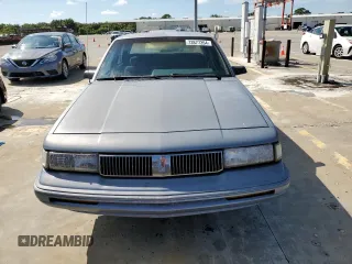 1996 Oldsmobile Cutlass Ciera 1SA VX5 z VIN 1G3AJ55M3T6326130, wystawiony jako Copart lot #73877264 z przebiegiem 74 073 mil mil oraz Szkody całkowita. Historia ofert i sprzedaży dostępna na DreamBid. Obrazek 5.