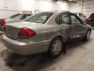 2006 Ford Taurus SE with VIN 1FAFP53U86A113947, listed as a IAAI auction lot 41753927 with 203,867 mi miles. Bid and sale history available at carsss.com. Image 4.