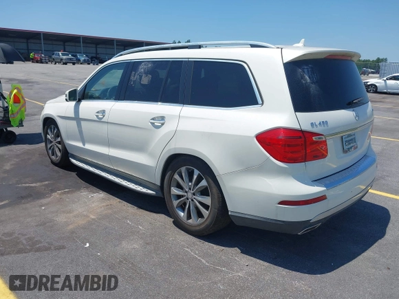 2014 Mercedes-Benz GL 450 with VIN 4JGDF7CE4EA348588, listed as a IAAI auction lot 42601136 with 129,166 mi miles and . Bid and sale history available at DreamBid. Image 3.