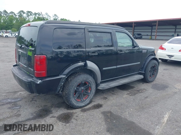 2007 Dodge Nitro SXT with VIN 1D8GT28K17W605984, listed as a IAAI auction lot 41970841 with 118,700 mi miles. Bid and sale history available at carsss.com. Image 4.