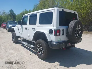2021 Jeep Wrangler Unlimited Rubicon with VIN 1C4HJXFG5MW586842, listed as a IAAI auction lot 42186683 with 76,450 mi miles and . Bid and sale history available at DreamBid. Image 3.