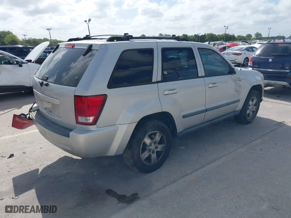 2007 Jeep Grand Cherokee Laredo with VIN 1J8GS48K57C545151, listed as a IAAI auction lot 41959178 with 148,534 mi miles. Bid and sale history available at carsss.com. Image 4.