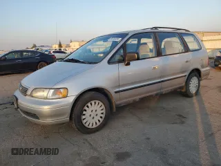 1997 Honda Odyssey with VIN JHMRA1842VC003732, listed as a Copart auction lot 86205204 with 136,693 mi miles and Salvage title. Bid and sale history available at DreamBid. Image 1.