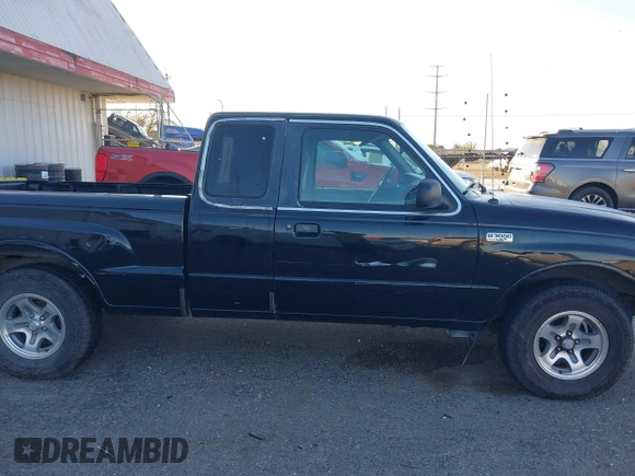 1999 Mazda B-Series 2WD Truck SE with VIN 4F4YR16V8XTM09770, listed as a IAAI auction lot 41416620 with 245,604 mi miles. Bid and sale history available at carsss.com. Image 14.