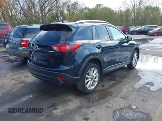2015 Mazda CX-5 Grand Touring with VIN JM3KE4DY7F0478823, listed as a IAAI auction lot 40731626 with 82,884 mi miles. Bid and sale history available at carsss.com. Image 4.