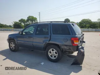 2002 Jeep Grand Cherokee Laredo with VIN 1J4GW48S92C319161, listed as a Copart auction lot 59304035 with 257,907 mi miles and Salvage title. Bid and sale history available at DreamBid. Image 2.