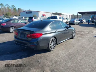 2018 BMW 5 Series M550i xDrive with VIN WBAJB9C57JG463933, listed as a IAAI auction lot 41295711 with 99,173 mi miles and . Bid and sale history available at carsss.com. Image 4.