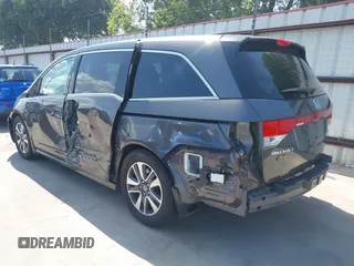 2014 Honda Odyssey Touring with VIN 5FNRL5H99EB075979, listed as a IAAI auction lot 42520154 with 99,314 mi miles and . Bid and sale history available at DreamBid. Image 3.