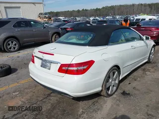 2011 Mercedes-Benz E-Class E 550 with VIN WDDKK7CF4BF093607, listed as a IAAI auction lot 41596557 with 128,548 mi miles. Bid and sale history available at carsss.com. Image 4.