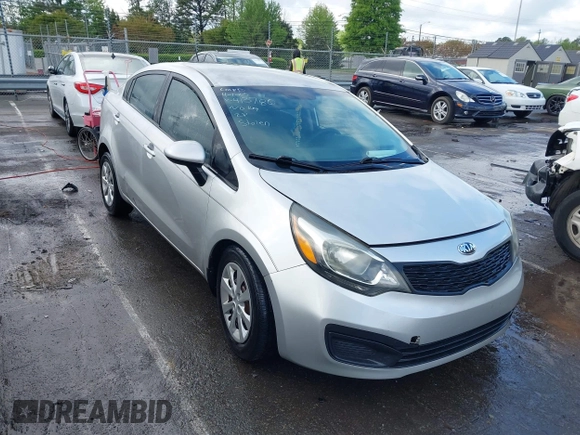 2014 Kia Rio LX with VIN KNADM4A31E6413780, listed as a IAAI auction lot 41996928 with 93,446 mi miles and . Bid and sale history available at DreamBid. Image 1.