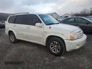 2004 Suzuki XL7 LX z VIN JS3TX92V544113433, wystawiony jako Copart lot #84066144 z przebiegiem 164 390 mil mil oraz Szkoda całkowita • Salvage title. Historia ofert i sprzedaży dostępna na DreamBid. Obrazek 4.