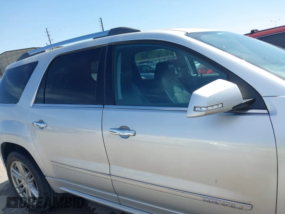 2014 GMC Acadia Denali z VIN 1GKKRTKD0EJ192610, wystawiony jako IAAI lot #41819095 z przebiegiem 121 075 mil mil oraz . Historia ofert i sprzedaży dostępna na DreamBid. Obrazek 13.