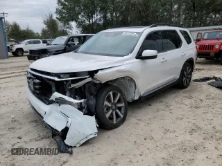 2025 Honda Pilot Touring with VIN 5FNYG2H76SB007454, listed as a Copart auction lot 88125485 with 10,065 mi miles and Salvage Title. Bid and sale history available at carsss.com. Image 1.