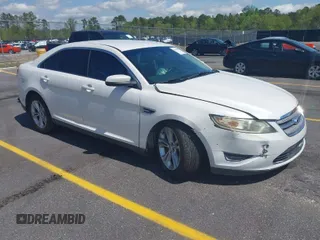 2014 Ford Taurus SEL with VIN 1FAHP2E86EG132676, listed as a IAAI auction lot 41943392 with 183,633 mi miles. Bid and sale history available at carsss.com. Image 1.