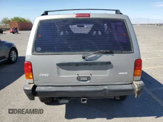 2000 Jeep Cherokee SE with VIN 1J4FF27SXYL140055, listed as a Copart auction lot 70315454 with 176,017 mi miles and Salvage title. Bid and sale history available at DreamBid. Image 6.