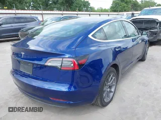 2019 Tesla Model 3 Mid Range with VIN 5YJ3E1EA5KF190453, listed as a IAAI auction lot 41880684 with 58,909 mi miles and . Bid and sale history available at carsss.com. Image 4.