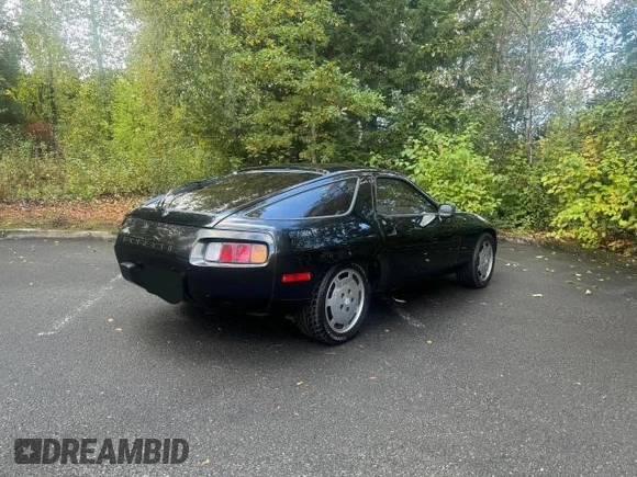 1982 Porsche 928 z VIN WP0JA0926CS821991, wystawiony jako Copart lot #76843574 z przebiegiem 84 762 mil mil oraz Tytuł czysty. Historia ofert i sprzedaży dostępna na DreamBid. Obrazek 4.
