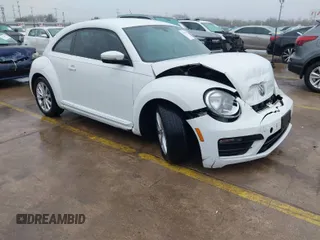 2018 Volkswagen Beetle S with VIN 3VWFD7AT3JM703443, listed as a IAAI auction lot 41437909 with 76,757 mi miles. Bid and sale history available at carsss.com. Image 1.