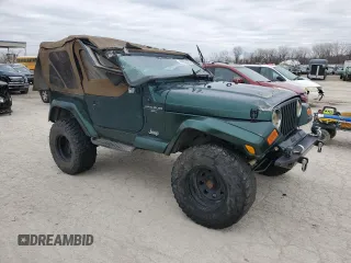 2000 Jeep Wrangler Sahara z VIN 1J4FA59S5YP803327, wystawiony jako Copart lot #44382505 z przebiegiem Nie podano mil oraz Szkoda całkowita • Salvage title. Historia ofert i sprzedaży dostępna na DreamBid. Obrazek 4.