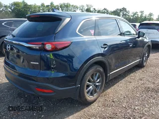 2021 Mazda CX-9 Touring with VIN JM3TCBCY7M0507699, listed as a IAAI auction lot 42603614 with 62,635 mi miles and . Bid and sale history available at DreamBid. Image 4.