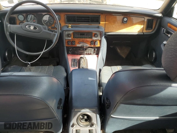 1986 Jaguar XJ z VIN SAJAV1346GC461014, wystawiony jako Copart lot #57785915 z przebiegiem 53 433 mil mil oraz Czysty tytuł • Clean title. Historia ofert i sprzedaży dostępna na DreamBid. Obrazek 8.