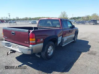 1999 GMC New Sierra 1500 SLE with VIN 2GTEK19T3X1525779, listed as a IAAI auction lot 41986559 with 254,123 mi miles. Bid and sale history available at carsss.com. Image 4.