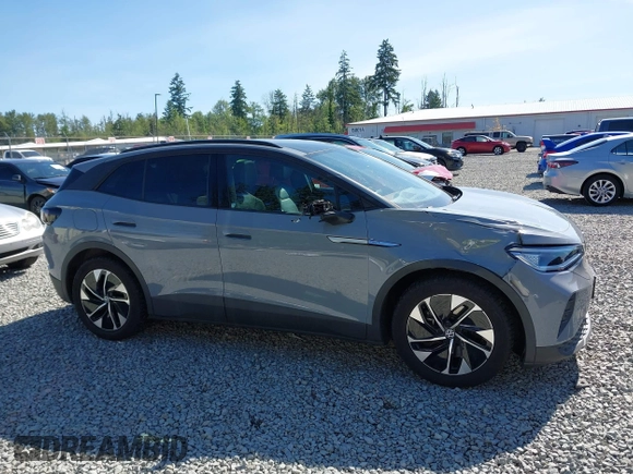 2021 Volkswagen ID.4 Pro S z VIN WVGTMPE20MP058882, wystawiony jako IAAI lot #42317440 z przebiegiem 64 473 mil mil oraz . Historia ofert i sprzedaży dostępna na DreamBid. Obrazek 13.