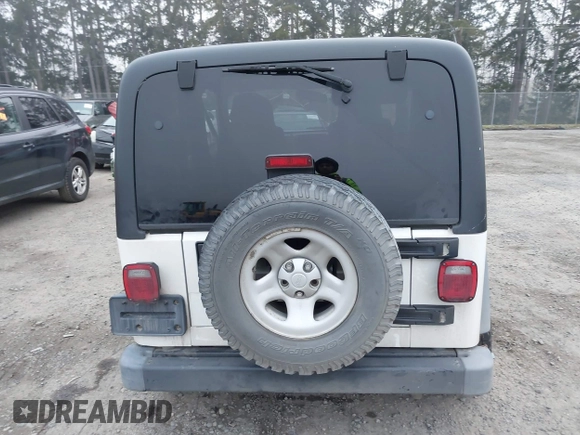2006 Jeep Wrangler Sport Right Hand Drive with VIN 1J4F449S16P709895, listed as a IAAI auction lot 41349311 with 157,125 mi miles. Bid and sale history available at carsss.com. Image 16.