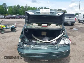 2001 Toyota Avalon XL z VIN 4T1BF28B11U168387, wystawiony jako IAAI lot #42186182 z przebiegiem 129 935 mil mil oraz . Historia ofert i sprzedaży dostępna na DreamBid. Obrazek 6.