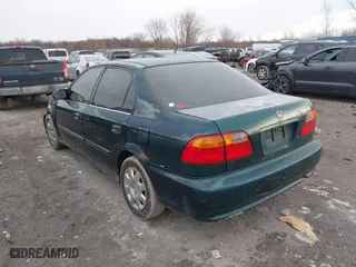 1999 Honda Civic VP with VIN 2HGEJ6617XH537283, listed as a IAAI auction lot 41483084 with 153,655 mi miles. Bid and sale history available at carsss.com. Image 3.