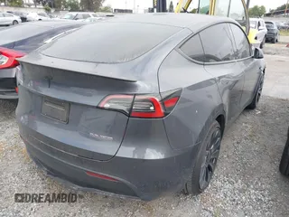 2023 Tesla Model Y Performance z VIN 7SAYGDEF6PF774965, wystawiony jako IAAI lot #41655550 z przebiegiem 33 824 mil mil oraz . Historia ofert i sprzedaży dostępna na DreamBid. Obrazek 4.
