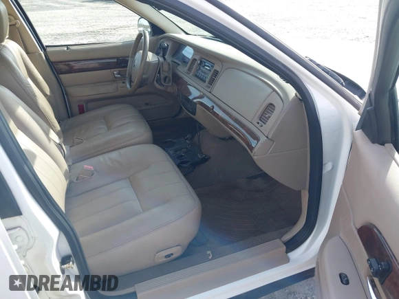 2005 Mercury Grand Marquis LS Premium z VIN 2MEFM75W05X621461, wystawiony jako IAAI lot #41381365 z przebiegiem 139 971 mil mil oraz . Historia ofert i sprzedaży dostępna na DreamBid. Obrazek 5.
