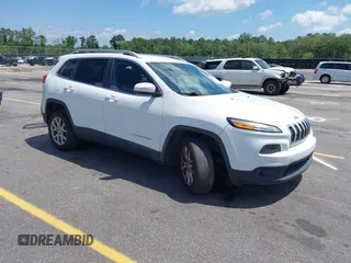 2016 Jeep Cherokee Latitude with VIN 1C4PJLCB0GW291357, listed as a IAAI auction lot 42312356 with 105,692 mi miles and . Bid and sale history available at DreamBid. Image 1.
