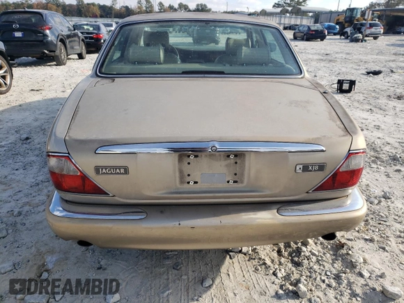 1998 Jaguar XJ with VIN SAJHX1242WC845736, listed as a Copart auction lot 82006044 with 188,785 mi miles and Salvage title. Bid and sale history available at DreamBid. Image 6.