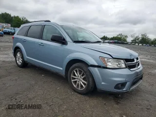 2013 Dodge Journey SXT with VIN 3C4PDCBG0DT619382, listed as a Copart auction lot 56565205 with 176,112 mi miles and Salvage title. Bid and sale history available at DreamBid. Image 4.