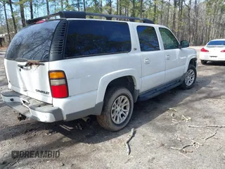 2004 Chevrolet Suburban Z71 with VIN 3GNFK16Z54G314817, listed as a IAAI auction lot 41613299 with 360,310 mi miles. Bid and sale history available at carsss.com. Image 4.