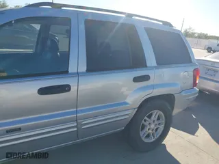 2004 Jeep Grand Cherokee Laredo with VIN 1J4GX48NX4C403936, listed as a IAAI auction lot 40855256 with 241,290 mi miles. Bid and sale history available at carsss.com. Image 6.