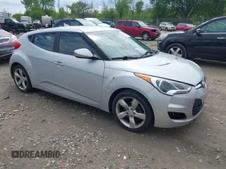 2014 Hyundai Veloster z VIN KMHTC6AD8EU182891, wystawiony jako IAAI lot #42363105 z przebiegiem 182 073 mil mil oraz . Historia ofert i sprzedaży dostępna na DreamBid. Obrazek 1.
