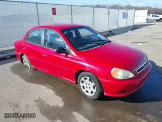 2002 Kia Rio with VIN KNADC123526160314, listed as a IAAI auction lot 41527989 with 124,252 mi miles. Bid and sale history available at carsss.com. Image 1.