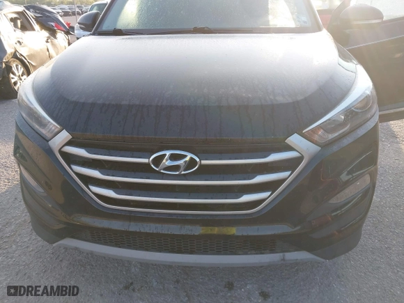 2017 Hyundai Tucson Value with VIN KM8J33A2XHU462806, listed as a IAAI auction lot 42045963 with 102,678 mi miles. Bid and sale history available at carsss.com. Image 6.
