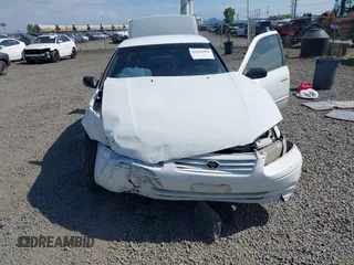 1999 Toyota Camry LE z VIN 4T1BG22K0XU862535, wystawiony jako IAAI lot #42116856 z przebiegiem 186 094 mil mil oraz . Historia ofert i sprzedaży dostępna na DreamBid. Obrazek 6.