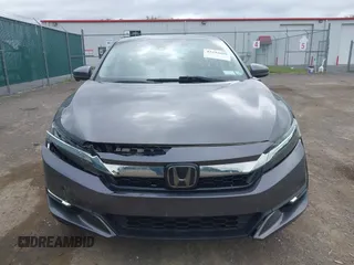 2018 Honda Clarity Touring z VIN JHMZC5F3XJC001054, wystawiony jako IAAI lot #42292688 z przebiegiem 60 780 mil mil oraz . Historia ofert i sprzedaży dostępna na DreamBid. Obrazek 6.