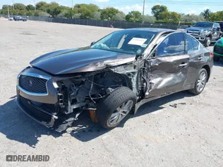 2015 Infiniti Q50 Premium with VIN JN1BV7AR4FM395093, listed as a IAAI auction lot 41907653 with 138,319 mi miles. Bid and sale history available at carsss.com. Image 2.