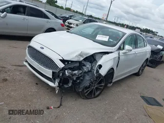 2020 Ford Fusion Titanium с VIN 3FA6P0D98LR151810, выставлен на аукционе IAAI как лот 42590902 с пробегом 76 624 миль миль и . История ставок и продаж доступна на DreamBid. Изображение 2.