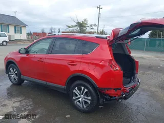 2016 Toyota RAV4 LE with VIN JTMBFREV2GJ097058, listed as a IAAI auction lot 41720372 with 118,606 mi miles. Bid and sale history available at carsss.com. Image 3.