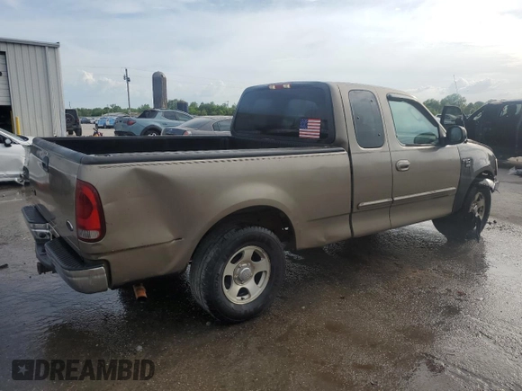 2003 Ford F-150 XL with VIN 1FTRX17LX3NA38576, listed as a Copart auction lot 54057495 with 173,811 mi miles and Salvage title. Bid and sale history available at DreamBid. Image 3.