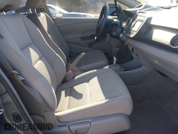 2010 Honda Insight LX with VIN JHMZE2H50AS019740, listed as a IAAI auction lot 41665527 with 74,022 mi miles and . Bid and sale history available at DreamBid. Image 5.